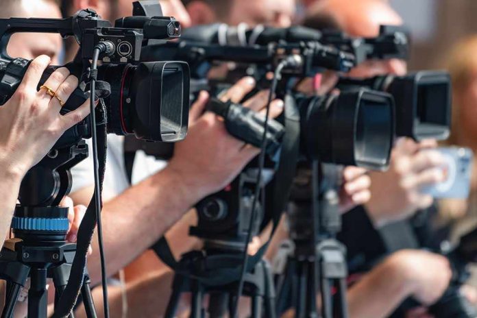 shutterstock_2692761619-3 television cameras on tripods at a media event