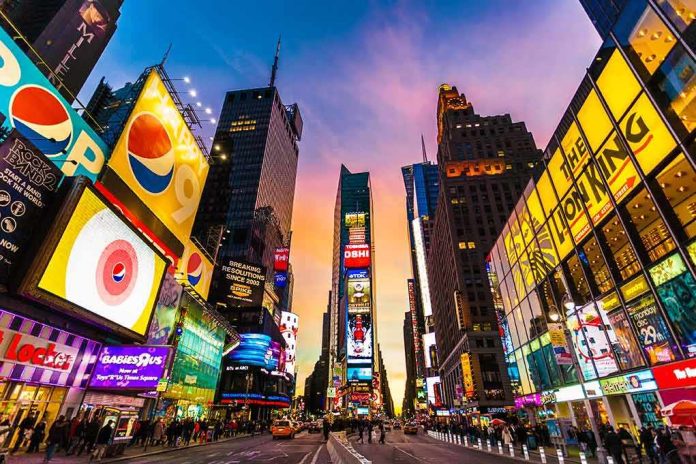 shutterstock_376302562 Times Square street with bright billboards at sunset