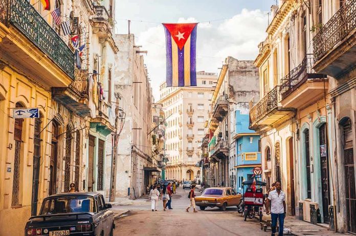 Cuban flag over colorful old Havana street