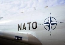 Aircraft fuselage with NATO emblem and lettering