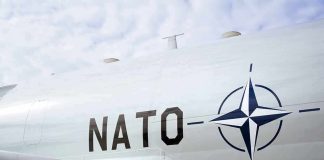 Aircraft fuselage with NATO emblem and lettering