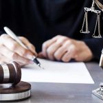 Trump BLASTS Biden’s DESPERATE DOJ Lawsuit! Judge writing at desk with gavel and Lady Justice statue