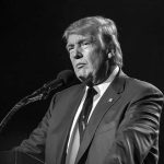 Liberal Host Gets Wrecked for Screwing Up Fact-Check During Trump’s Speech Donald Trump speaking at a microphone in a black-and-white photo