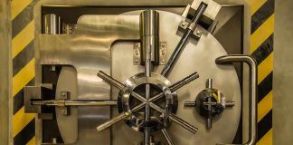 Vault door with steel locking wheel and handle