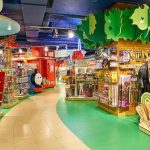Transgender Care Bear’s Hit Shelves – Parents OUTRAGED! toy store aisle with colorful shelves and displays