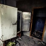 IRS Office Chaos – Rats OVERUN Workplace! Abandoned room with open, rusted refrigerators and a dark doorway