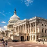 GOP Reps Shock Proposal – Foreign Citizens BANNED United States Capitol building with dome and columns under a blue sky