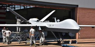 81 U.S. Aircraft Hit – Congress Blindsided Military drone being serviced by ground crew outside a hangar
