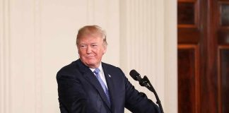 Trump Slammed for Tiger Death Clip Post man at podium with presidential seal