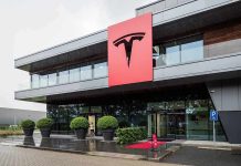 Tesla office building with large red logo sign
