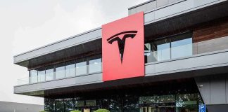 Tesla office building with large red logo sign