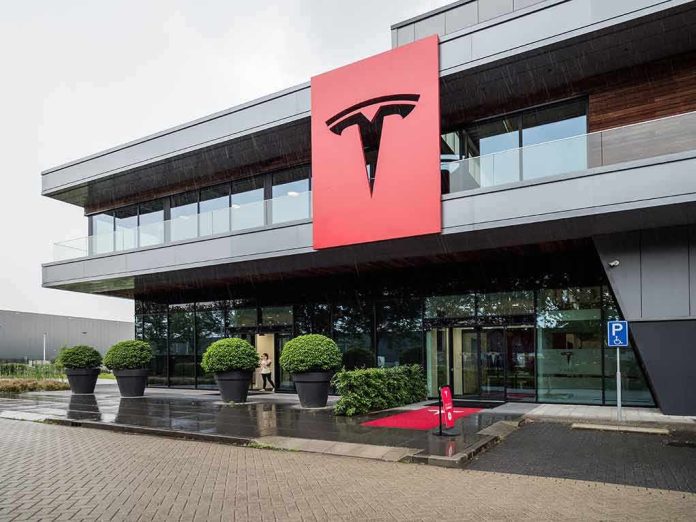 Tesla office building with large red logo sign