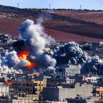 Houthis DESTROY Saudi Airport – Explosion Rocks Region Urban explosion with thick smoke over city buildings