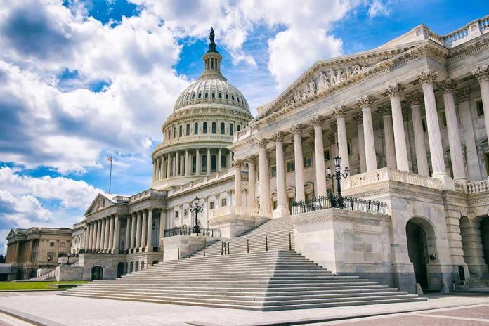 United States Capitol building with dome and columns under a partly cloudy sky