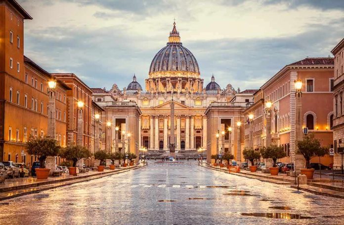 St. Peter's Basilica at the end of a wet street at dusk