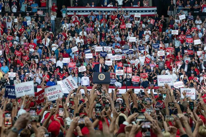 shutterstock_1480255829 Tavon Wilson in a large crowd at a political rally