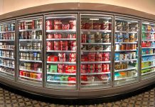 Grocery store freezer aisle with ice cream and frozen desserts