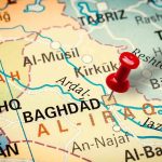 Iraq Celebrates While U.S Troops Pull-Out After 23 Years Map of Iraq with red pushpin near Baghdad