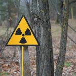 radiation warning sign in a wooded area
