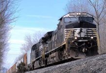 Freight train locomotive on a wooded track