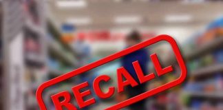 Recall notice over blurred supermarket aisle