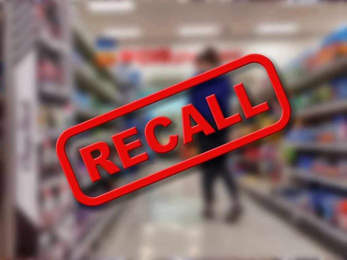 Recall notice over blurred supermarket aisle