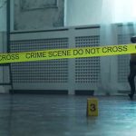 93-Year-Old Raped and Strangled By Illegal Crime scene tape across a room with evidence marker on floor