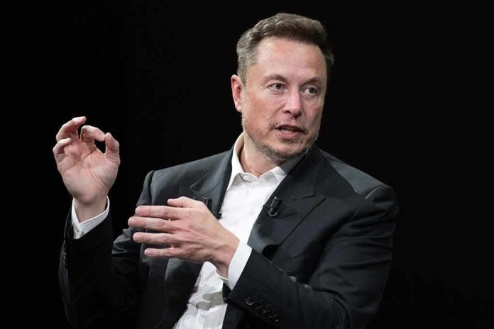 Elon Musk speaking in a black suit against a dark background