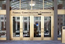 Federal Communications Commission building entrance with gold doors