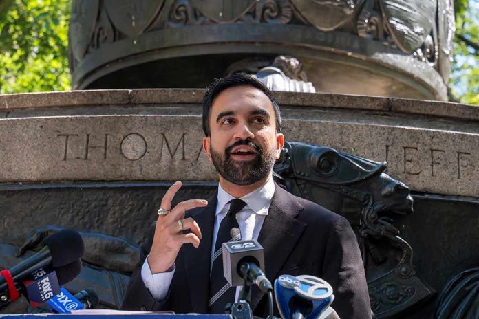 shutterstock_2668981483 Zohran Mamdani speaking at an outdoor press conference