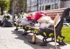 Person sleeping on park bench