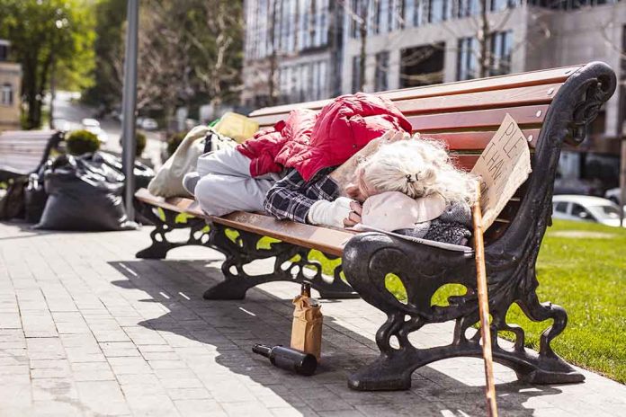 Person sleeping on park bench