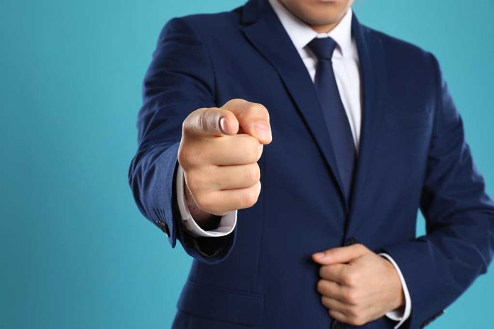 Man in a suit pointing finger