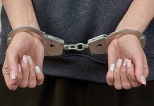 woman's hands in handcuffs