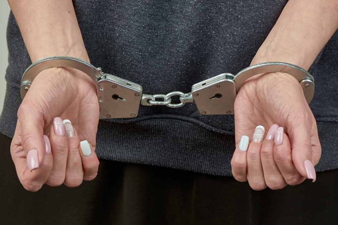 woman's hands in handcuffs