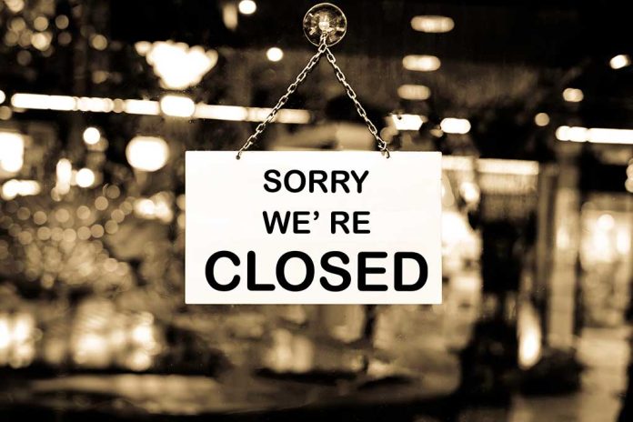 Closed sign hanging in a shop window