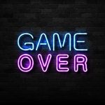 game over neon sign on brick wall.