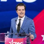 Person speaking at podium with CPAC backdrop.