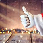 Santa hand giving thumbs up Christmas lights