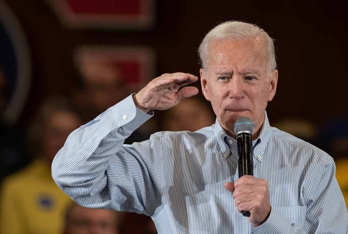 Man speaking into microphone, saluting gesture.