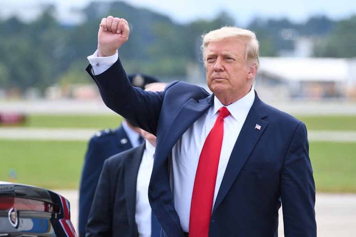 Man in suit raising fist outdoors near vehicle