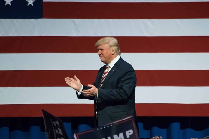 Man clapping in front of American flag background