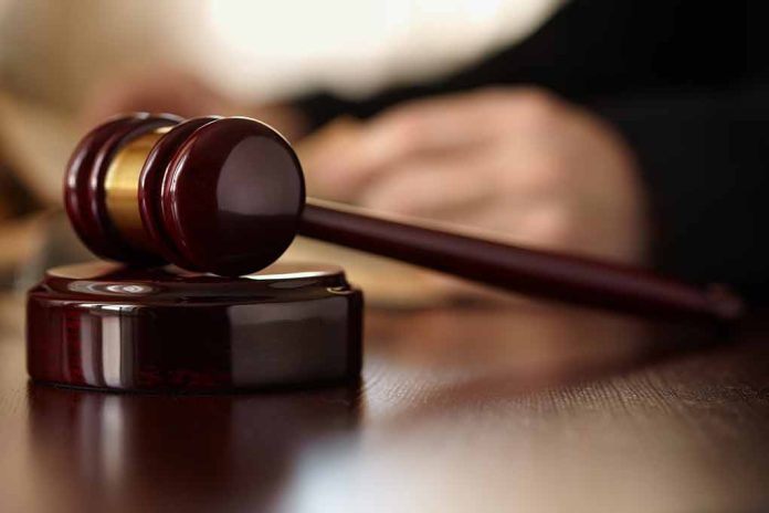 Wooden gavel resting on a judge's desk.