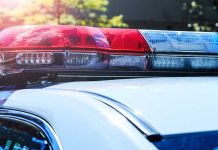 Police car roof with red and blue lights.