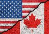 USA and Canada flag divided by crack