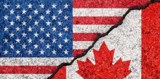 USA and Canada flag divided by crack