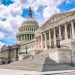 United States Capitol building with cloudy blue sky