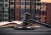 Gavel and open book in library setting