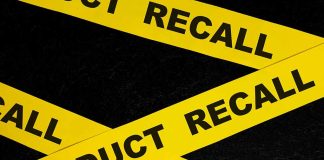 Yellow tape with product recall text crossing
