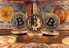 Bitcoins and Bitcoin themed banknotes in various designs